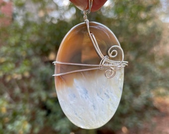 Cream Agate with Crystals wire wrapped pendant. Translucent stone. Reversible. Cord included.