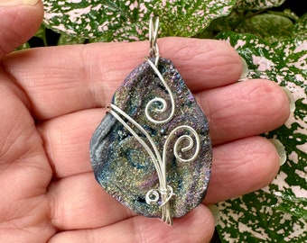 Sparkly Druzy wire wrapped pendant. Reversible to a rustic matte side. Cord included.
