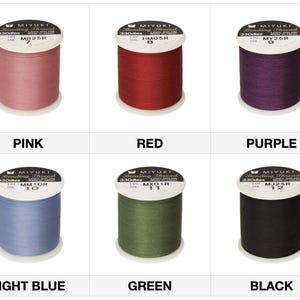 May include: Six spools of Miyuki beading thread in various colors: pink, red, purple, light blue, green, and black. Each spool is labeled with the thread color and a product code. The image is a product display for beading supplies.