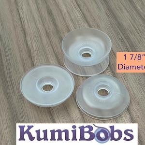 May include: Three clear plastic bobbins with a 1 7/8 inch diameter. The bobbins are designed for use with sewing machines.