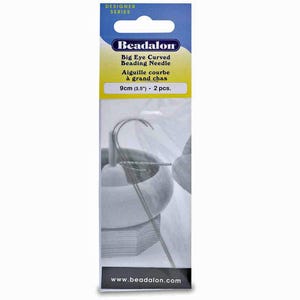 May include: A package of Beadalon Big Eye Curved Beading Needles. The package is white, blue, and yellow, with the brand name and product information printed on the front. The package contains two 9cm (3.5") needles.