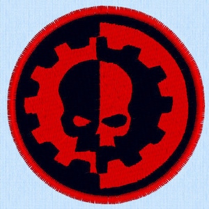 May include: A black and red circular patch with a skull and gear design. The skull is split in half, with the left side black and the right side red. The gear is black and surrounds the skull.