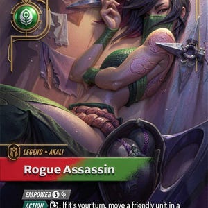 May include: A collectible trading card titled Rogue Assassin featuring a character with dark hair, a green face mask, and tattoos, holding a kunai dagger. The card displays game text, icons, and the artist name Jessica Oyhenart, dated 2026RGI.