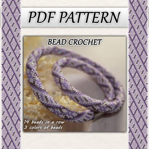 May include: A close-up of a beaded crochet design in shades of purple, white, and black. The text "PDF PATTERN" and "BEAD CROCHET" are at the top. The text at the bottom says "14 beads in a row" and "3 colours of beads".