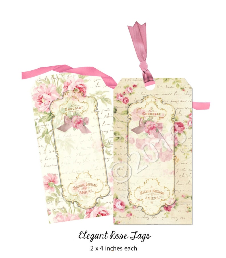 K&ouml;nnte beinhalten: Zwei rosa und wei&szlig;e Geschenkanh&auml;nger mit Blumenmuster und dem Text "CHOCOLAT" und "MAGNIEZ BAUSSART AMIENS". Die Anh&auml;nger sind 5,1 cm x 10,2 cm gro&szlig;.