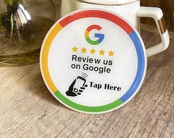 May include: A white round sticker with a colorful border. The sticker has a Google logo, five stars, and the text "Review us on Google Tap Here".