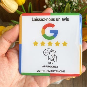 May include: A square white NFC review card with a Google logo, five gold stars, and the text "Leave us a review". The card also features a graphic of a smartphone and the words "NFC" and "APPROACH YOUR SMARTPHONE".
