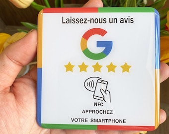 May include: A square white NFC review card with a Google logo, five gold stars, and the text "Leave us a review". The card also features a graphic of a smartphone and the words "NFC" and "APPROACH YOUR SMARTPHONE".