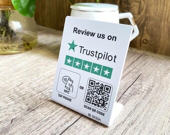 May include: A white, rectangular sign with the text "Review us on Trustpilot" and a five-star rating. The sign also features a QR code and NFC tap phone icon. The ID number "5430A" is printed at the bottom.