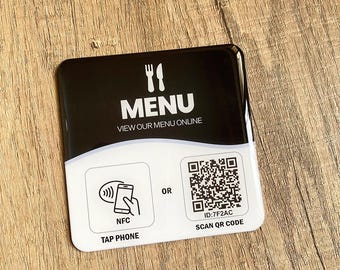 May include: A black and white menu card with the word "MENU" and a fork and knife icon. It features options to view the menu online, tap a phone via NFC, or scan a QR code.