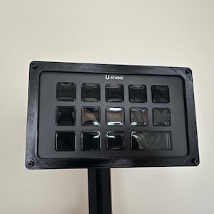 May include: A set of three ceramic mugs with a speckled, matte finish. Each mug is in a different colour: light blue, cream, and grey. The mugs have a simple, modern design and a comfortable handle.