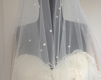 May include: A white bridal veil with a single layer of tulle and pearl embellishments.
