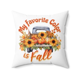 May include: White throw pillow featuring a watercolour illustration of a vintage pickup truck filled with pumpkins and sunflowers. The text "My favourite colour is Fall" is written in orange and yellow.