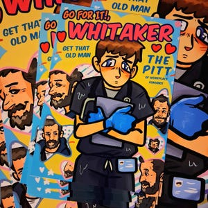 May include: A pile of vibrant art prints with a cartoon illustration of a person in a medical uniform holding a tablet. The prints feature text that reads "Go For It! Whitaker" and "Get That Old Man". The artwork has a comic book style.