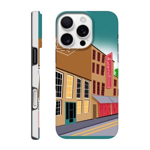 May include: A phone case featuring a stylized illustration of a brick building with the text "The LEADMILL" on a red sign. The building has multiple windows and a teal door. The case is brown, teal, and white.
