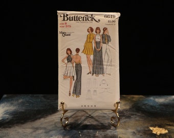Può includere: Modello di cucito vintage per una gonna e pantaloni di Butterick, con un design di Mary Quant. Il numero del modello è 6649 e il prezzo è di $ 1,00.