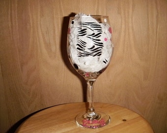 Zebra print monogram with dots wine glass