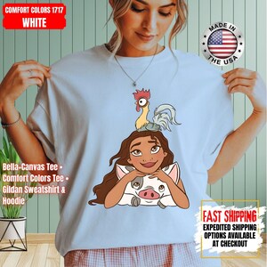 May include: A white ceramic mug with a black handle and the text "But First, Coffee" in a black, handwritten-style font. The mug is on a white surface.