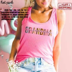 May include: Pink tank top with the word "Grandma" in colorful letters with a leopard print design. The names "Lucas", "Isabella", and "Charlotte" are written in smaller letters below the word "Grandma".
