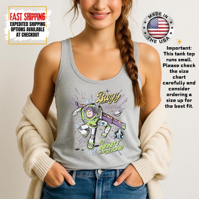 May include: A light grey vest top with a Buzz Lightyear graphic, including the text "Buzz Lightyear" and "To Infinity and Beyond." The vest also has text that says "Made in the USA" and "Fast Shipping".