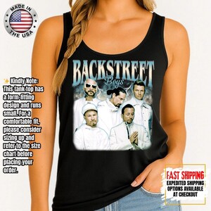May include: Black tank top featuring a graphic of the Backstreet Boys. The image includes the band's name in a stylized font and a photo of the band members. The tank top is made in the USA.