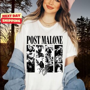 May include: A white short-sleeve t-shirt featuring a black and white graphic print of Post Malone in four distinct panels. The text POST MALONE is printed in a bold black font above the images, with a stylized signature graphic below the panels.