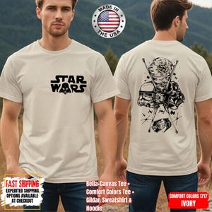 Op de afbeelding: Ivoor t-shirt met het Star Wars logo in zwart op de voorkant. De achterkant heeft een zwarte afbeelding van Star Wars-personages en -voertuigen. Gemaakt in de VS.