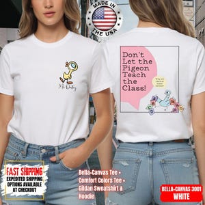 May include: A white t-shirt featuring a small yellow cartoon duck on the front left chest with the text Ms. Destiny. The back displays a large graphic with the text Don't Let the Pigeon Teach the Class! and a blue pigeon holding letter cards.