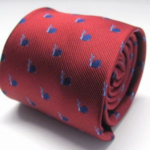 May include: Rolled red tie featuring a repeating pattern of small blue snails. The tie is made of a smooth fabric and is tightly rolled, displaying the pattern and texture.