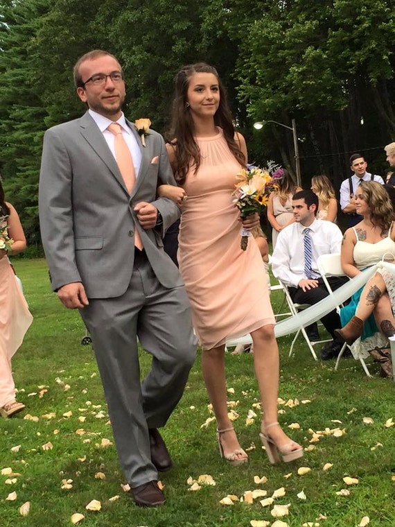 peach tie with grey suit