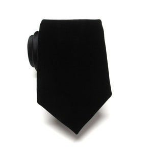 May include: A black velvet necktie.