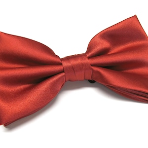May include: A red satin bow tie.