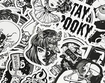 May include: A collection of black and white stickers featuring various designs, including a skull, a woman with butterflies, a skeleton, and the text "Stay spooky".