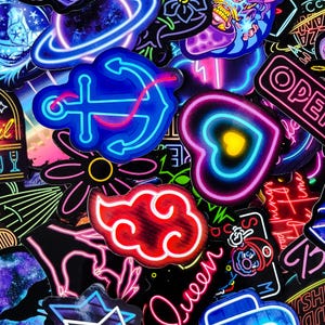 May include: A collection of neon-colored stickers featuring various designs, including an anchor, a heart, a cloud, a flower, and the word "Open".