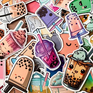 May include: A collection of colorful stickers featuring various bubble tea designs. The stickers feature different flavors, toppings, and cute cartoon characters. Some stickers have text that says "Boba" and "Milk Tea".