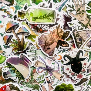 May include: A collection of colorful stickers featuring whimsical illustrations of mushrooms, a potion bottle, a fairy, a scroll, a goat, and a hand with leaves. The stickers are perfect for adding a touch of magic to journals, laptops, water bottles, and more.