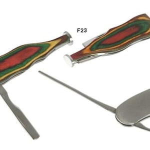 May include: Three pipe tools are displayed. Two have wooden handles with red, green, and yellow hues. The third tool has a silver handle. Each tool has a poker, a reamer, and a tamper. The tools are labeled F23 and F17.
