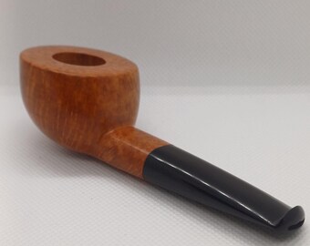 May include: A wooden smoking pipe with a brown bowl and a black stem.