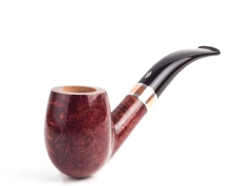 May include: A tobacco pipe with a polished reddish-brown briar wood bowl featuring a visible grain pattern. The stem is black acrylic with a curved shape, accented by a silver-toned metal band and a light-coloured ring. The word SAVINELLI is engraved.