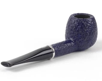 May include: A tobacco pipe featuring a deep blue, textured bowl and a smooth, glossy black stem. A thin silver-coloured metal band connects the bowl to the stem, which features a small, light-coloured emblem near the mouthpiece.