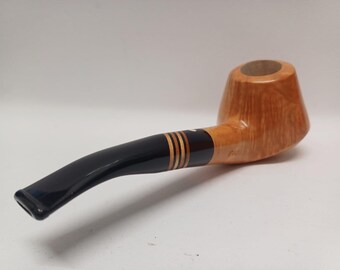 May include: A wooden tobacco pipe with a curved, black stem and a light brown bowl. The stem has gold-colored bands near the bowl. The pipe is set against a white background.