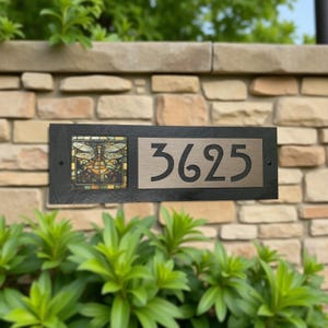 May include: A rectangular black slate house number sign featuring the digits 3625 in a metallic silver finish. To the left of the numbers is a square decorative tile displaying a colorful stained glass style dragonfly illustration.