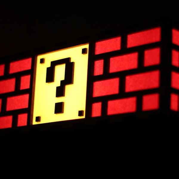 Lámpara colorida con forma de bloque de signo de interrogación de Mario: raíces de Nintendo