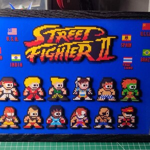 3D-Diorama Street Fighter II: Komplette World Warriors-Kämpferliste – Pixel-Art-Retro-Gaming-Framework – 3D-Wandbild für Spielzimmer – UpLayer