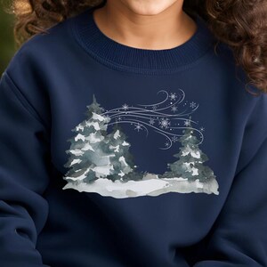 May include: Navy blue children's sweatshirt featuring a watercolor-style winter scene. The design showcases two stylized evergreen trees in a snowy landscape, with snowflakes and windswept lines adding to the wintery theme. The sweatshirt is a comfortable crewneck style, perfect for the holiday season.