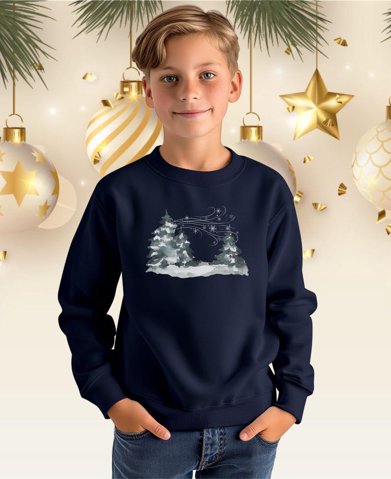 May include: Navy blue crew neck sweatshirt with a winter landscape design. The image shows snow-covered trees and swirling snowflakes in shades of grey and white. A festive garment.