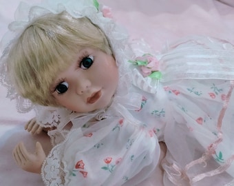 Vintage, Porcelain baby doll... With a soft body.  Like a little angel, very gentle.