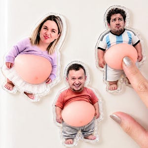 May include: Three custom photo magnets featuring cutouts of people with exaggerated, round, flesh-toned bellies. One magnet shows a person in a lavender sweater and white skirt, another in a red shirt and grey trousers, and one in a football jersey.