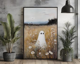 May include: A framed art print depicting a white ghost with black eyes in a field of wildflowers. The background shows a landscape with mountains and a cloudy sky. The artwork is displayed on a wooden floor with potted plants.