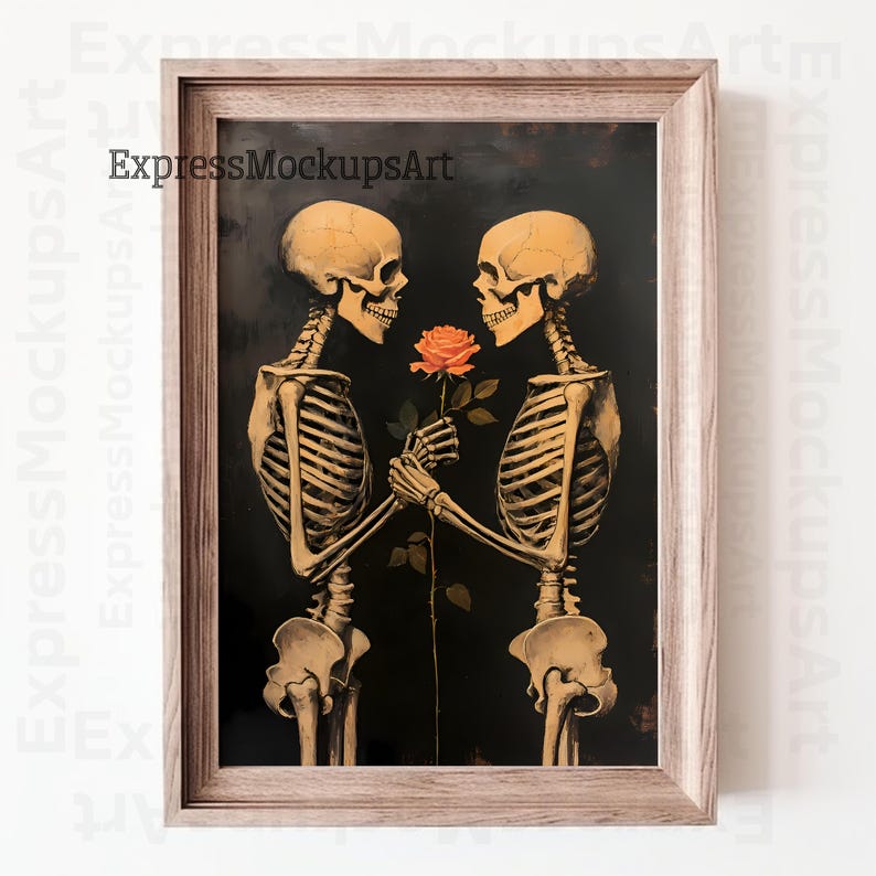 May include: Framed art print depicting two skeletons facing each other, holding a rose. The skeletons are beige, set against a black background. The rose is orange. The frame is light brown. A unique piece of home decor.